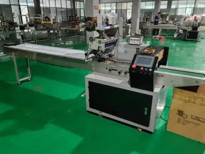 Automatic flow wrap machine in the factory