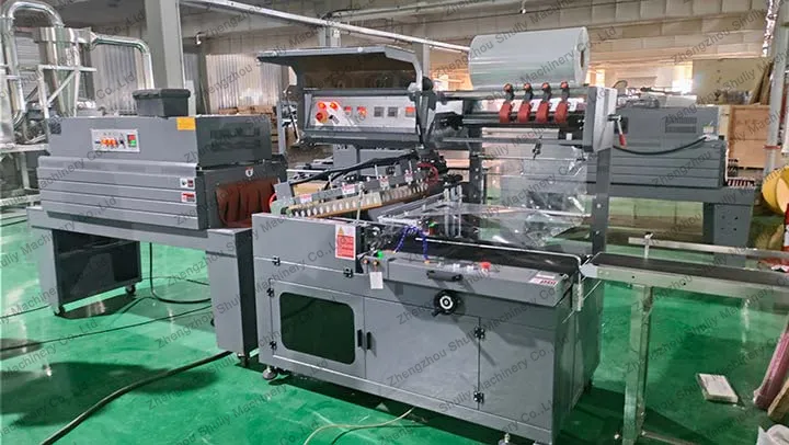 Automatic sealing and cutting machine and heat shrink machine
